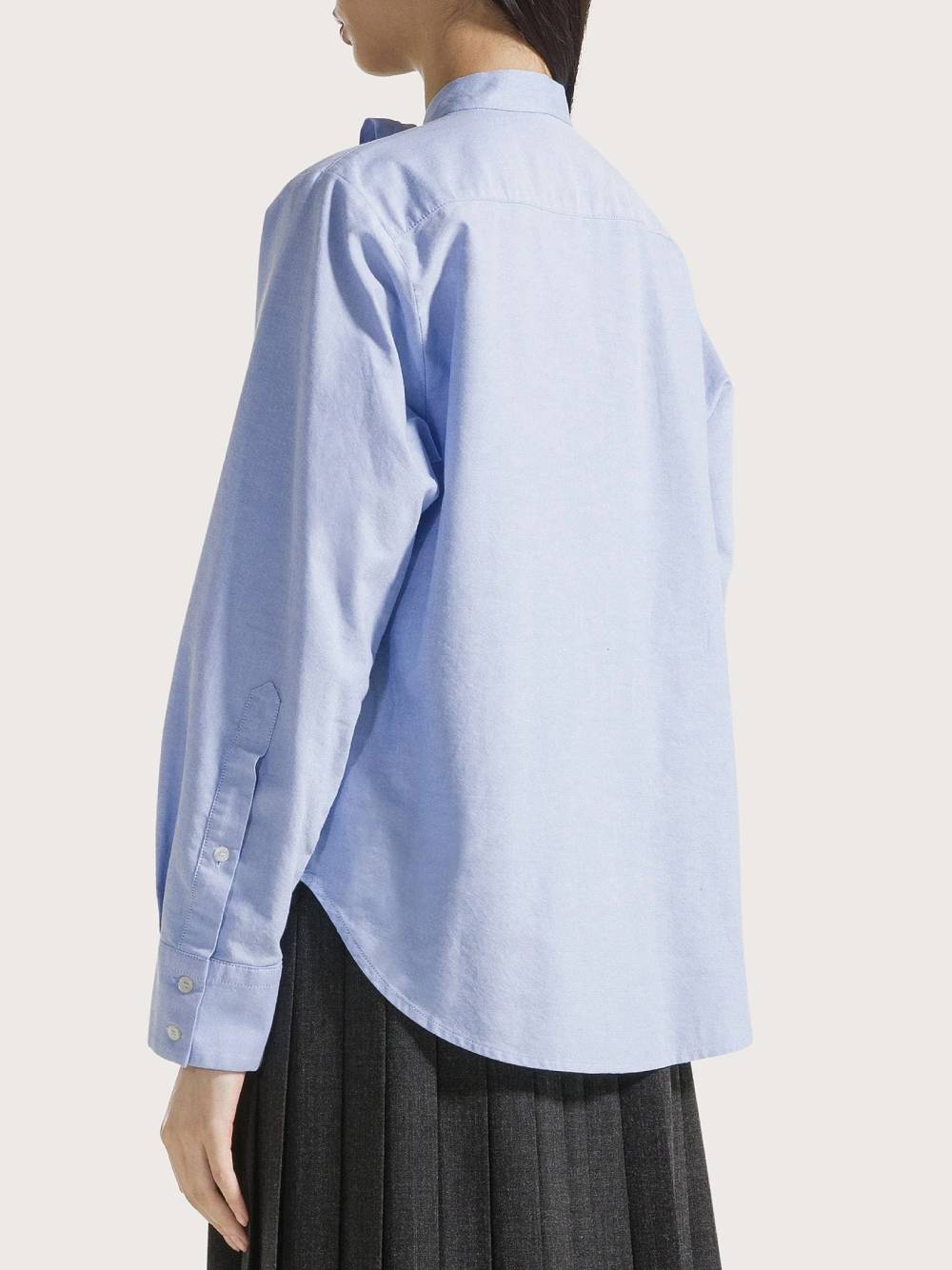19.70 Camicia in cotone azzurro con fiocco