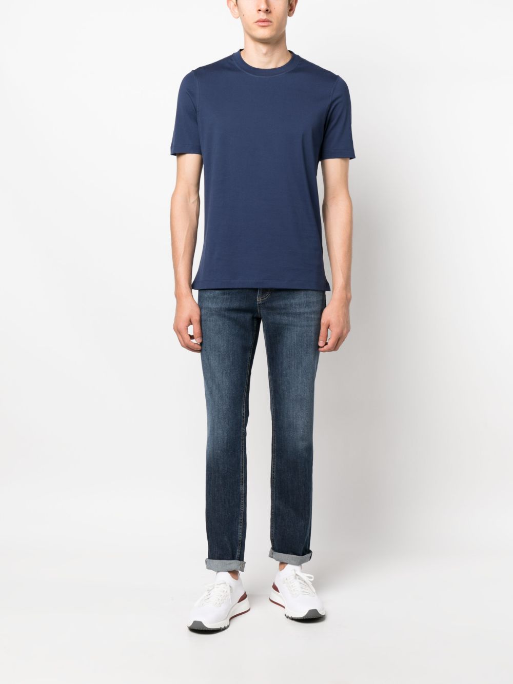 BRUNELLO CUCINELLI Jeans blu con risvolti alla caviglia ed effetto wash