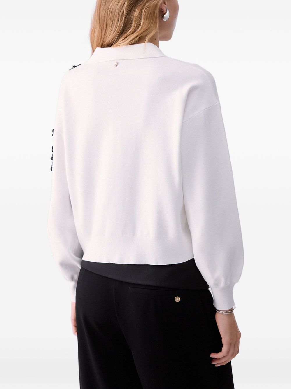 LIUJO Maglia bianca con scollo a V e strass neri