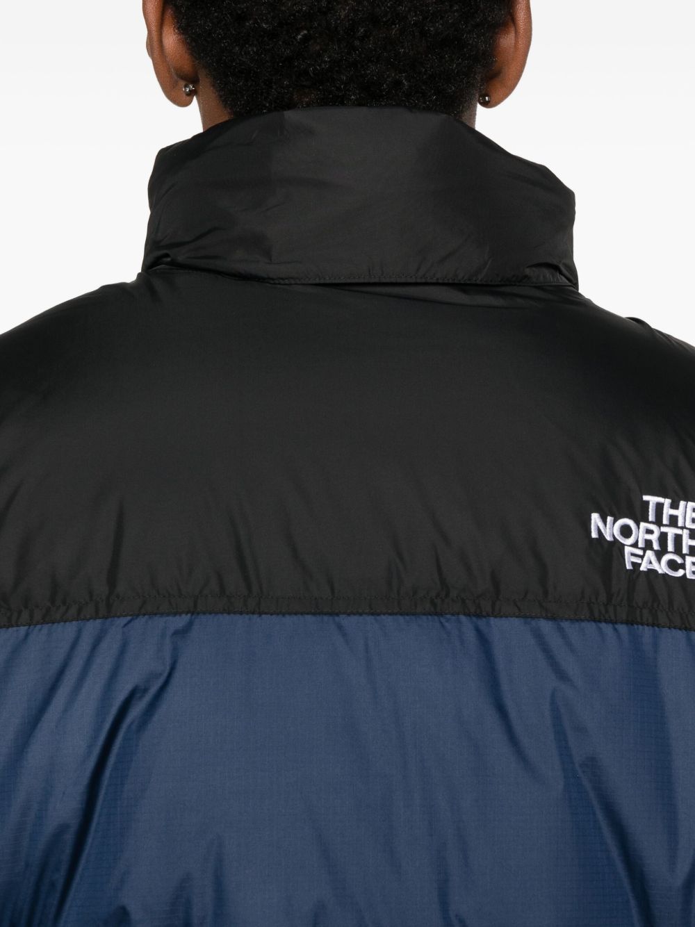 THE NORTH FACE Piumino corto con zip blu e nero con logo