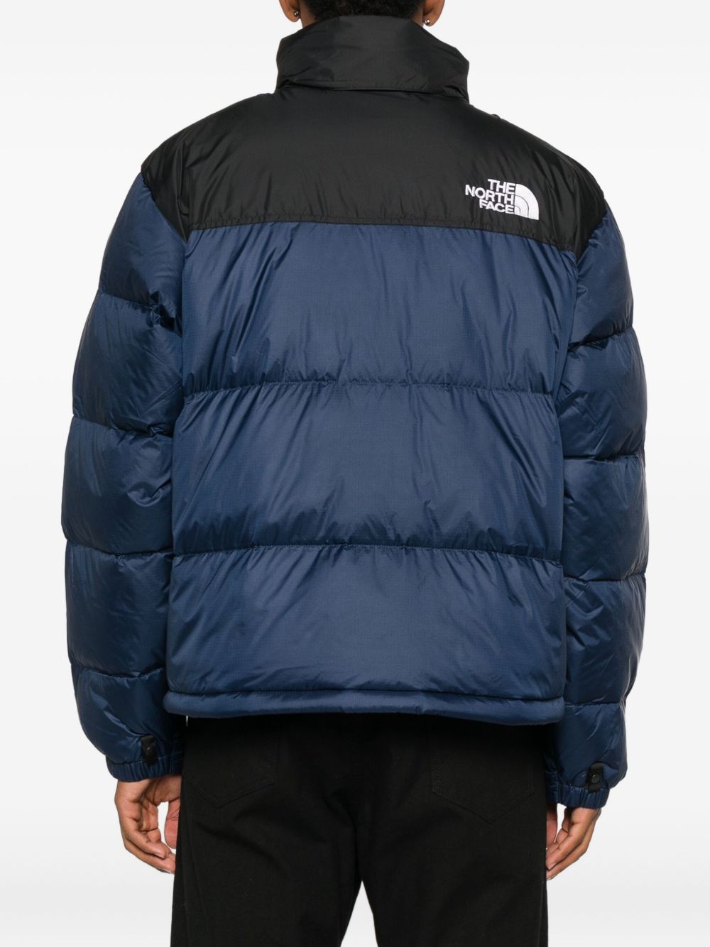 THE NORTH FACE Piumino corto con zip blu e nero con logo