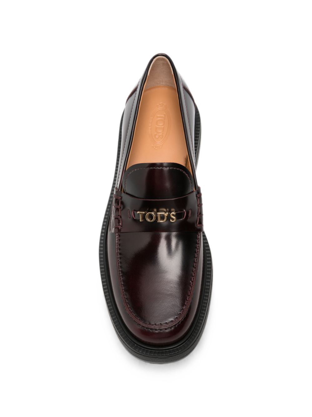 TODS Mocassini in pelle lucida bordeaux con placca logo dorata