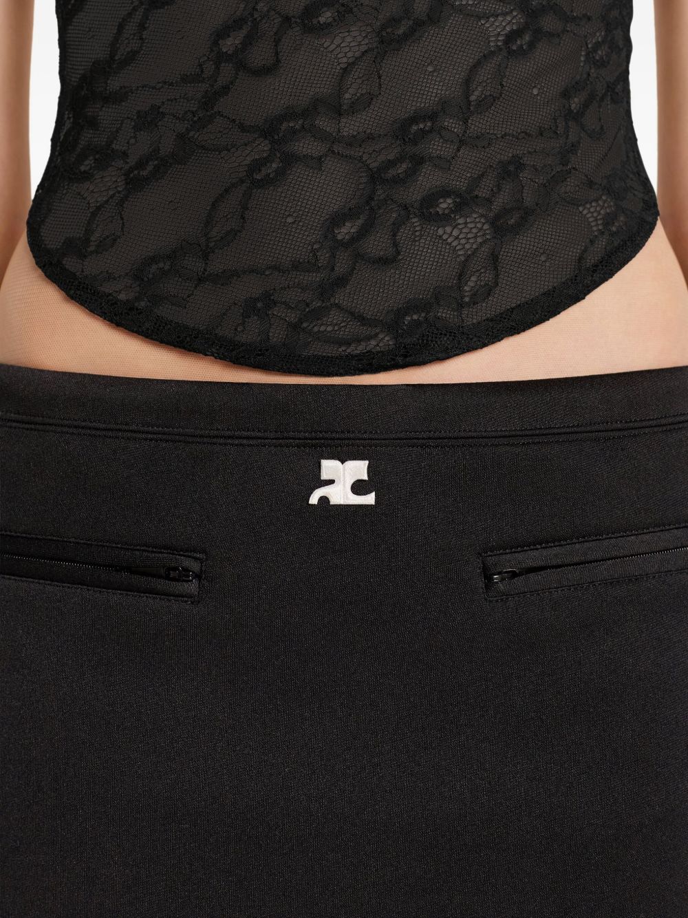 COURREGES Gonna nera con mini tasche frontali