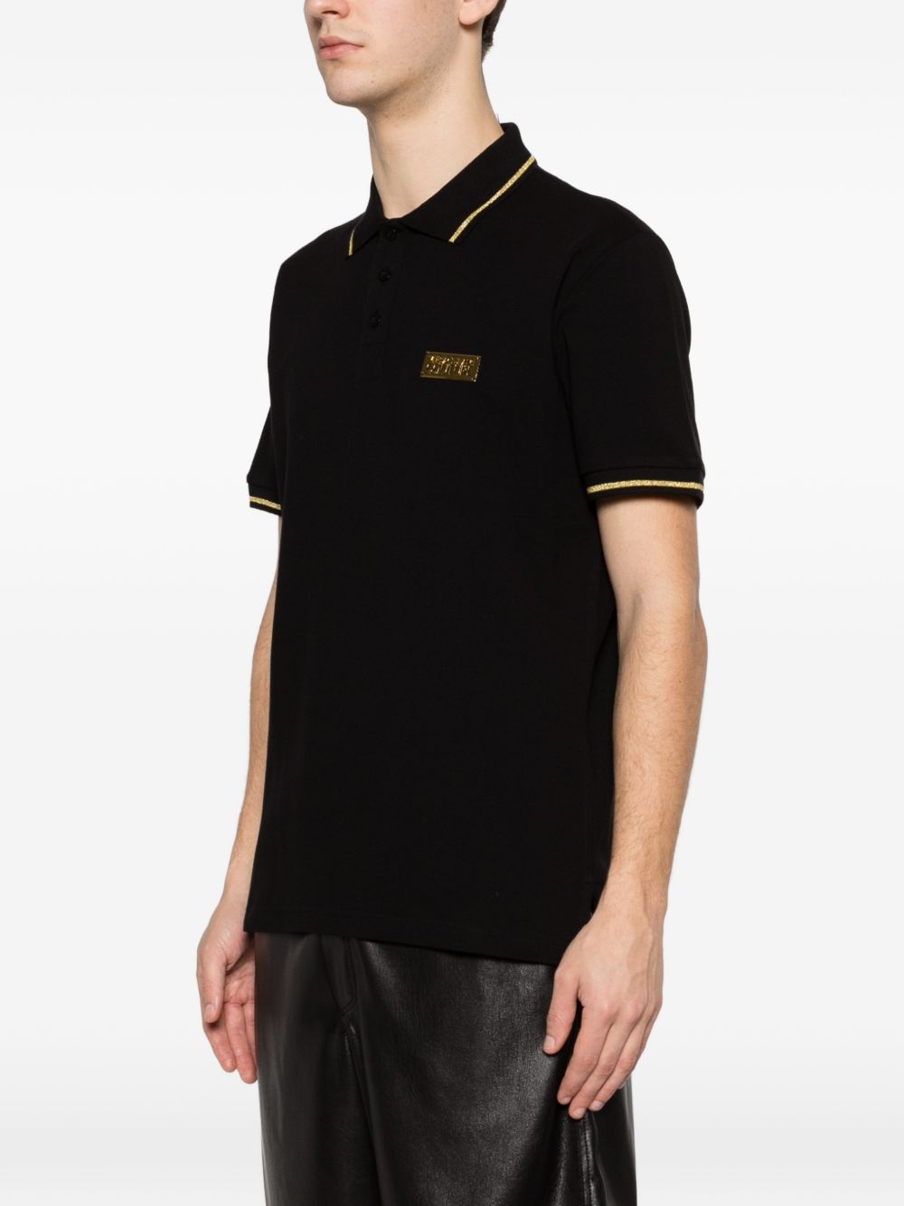 VERSACE JEANS COUTURE Polo nera con bordo a coste e logo