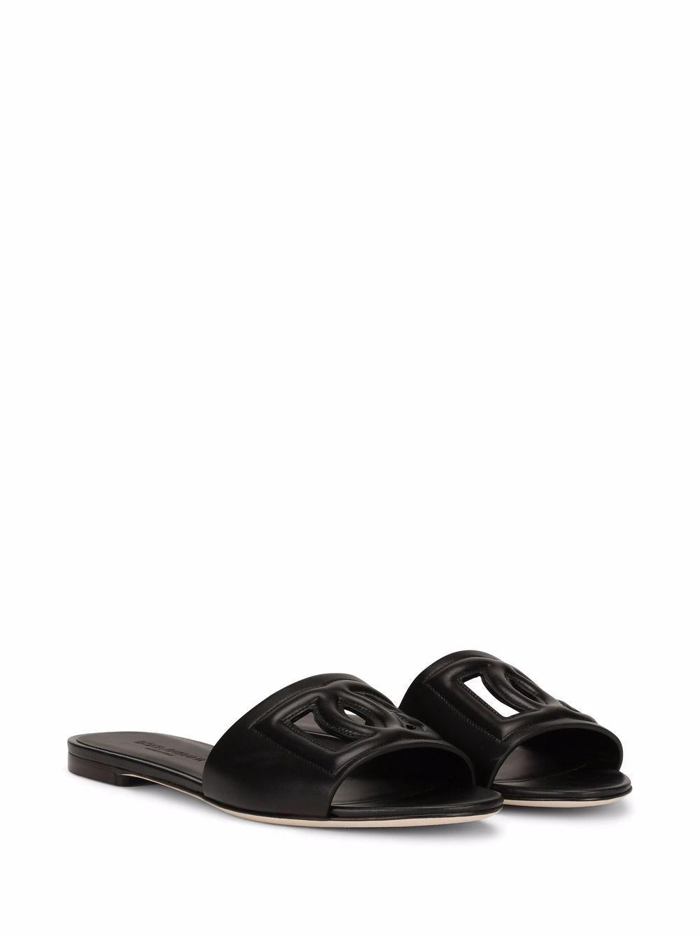 DOLCE e GABBANA Ciabatte basse in pelle nera con logo
