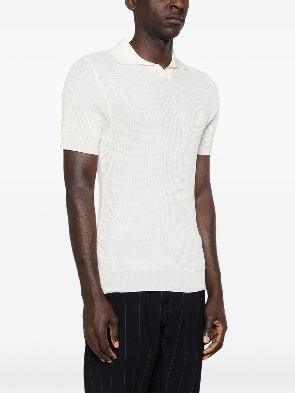 RAKKI T-shirt bianca con colletto polo