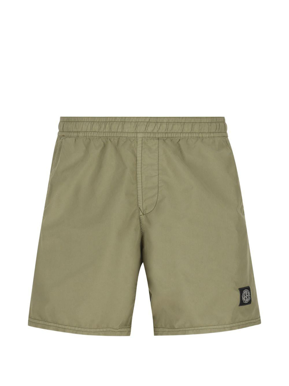 STONE ISLAND Costume verde con patch logo nero