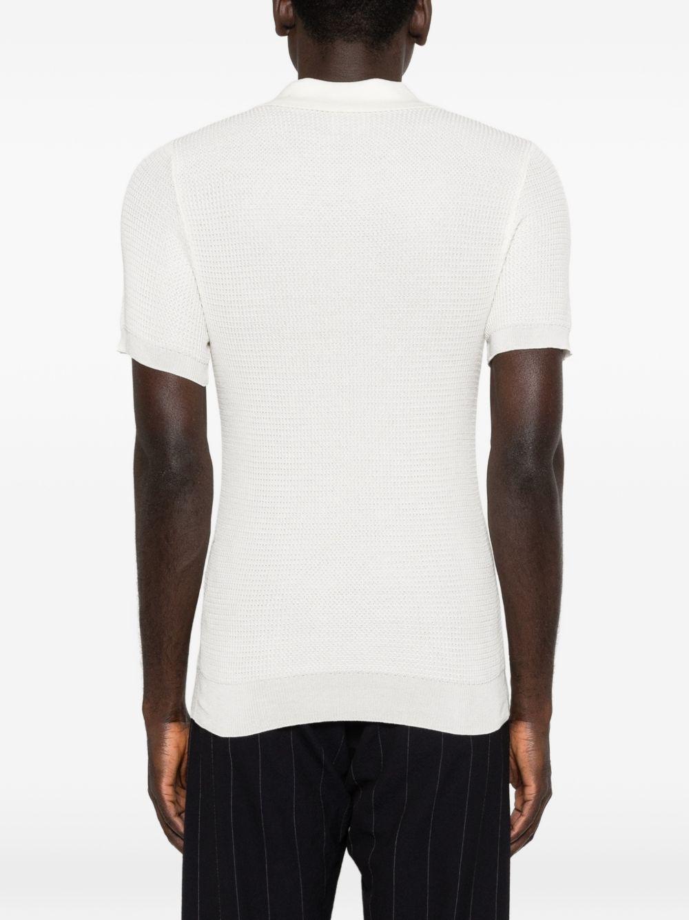 RAKKI T-shirt bianca con colletto polo