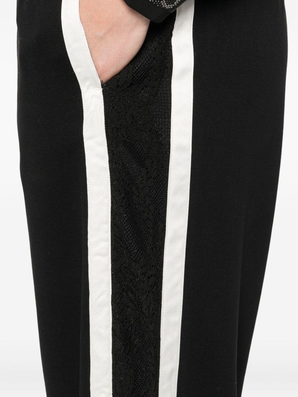 LIUJO Pantaloni neri sportivi bande laterali bianche