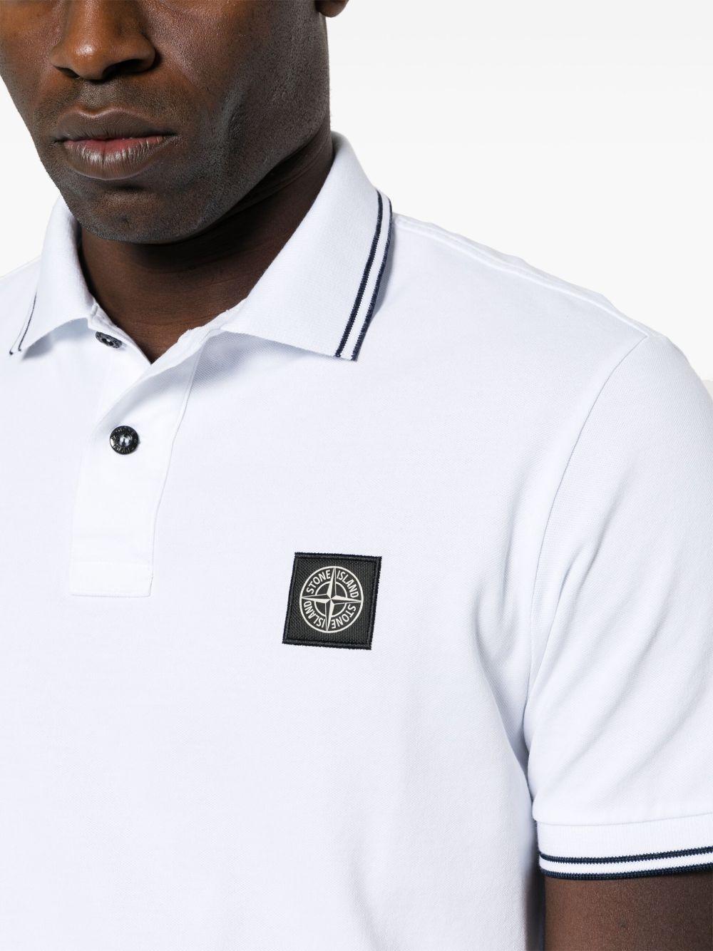 STONE ISLAND Polo in cotone bianco con logo