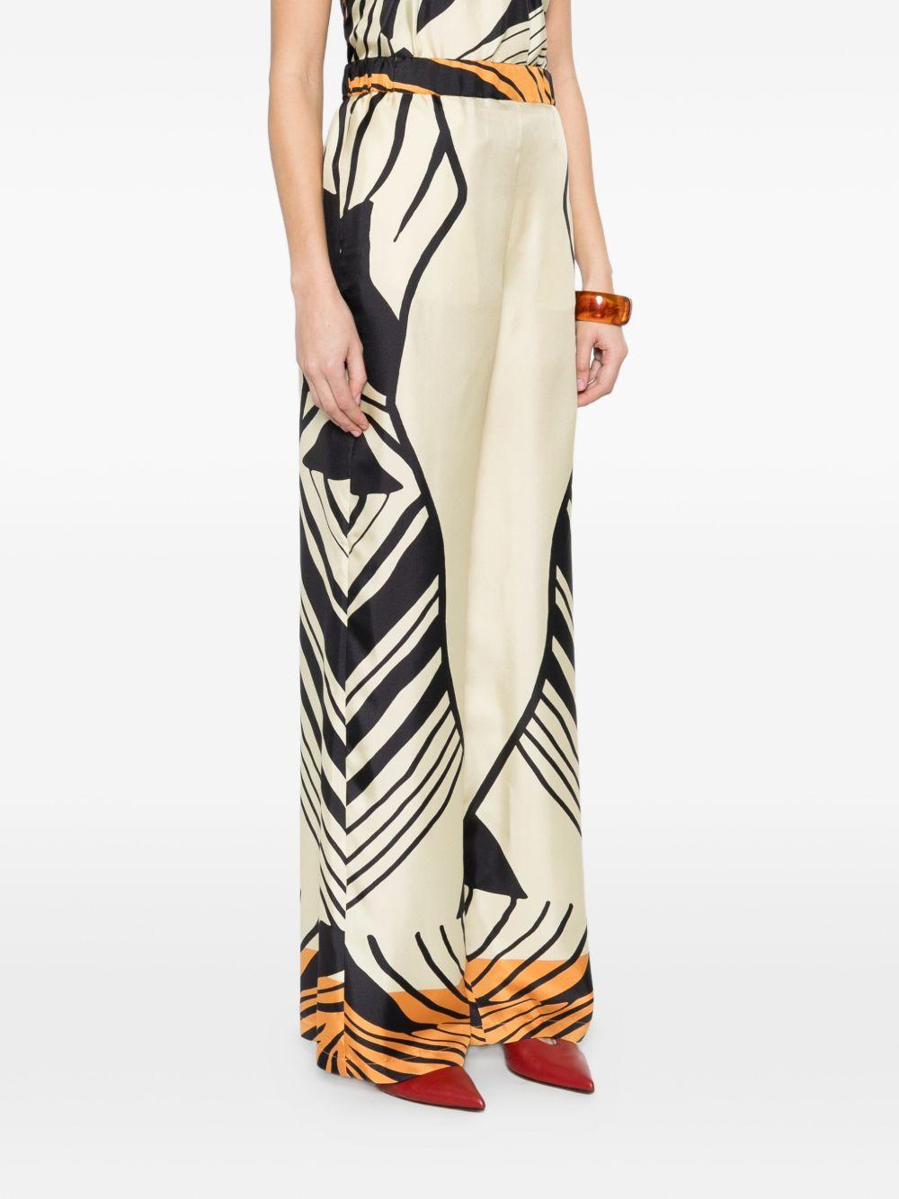 RAQUEL DINIZ Pantaloni con motivo astratto in seta avorio, nero, arancione