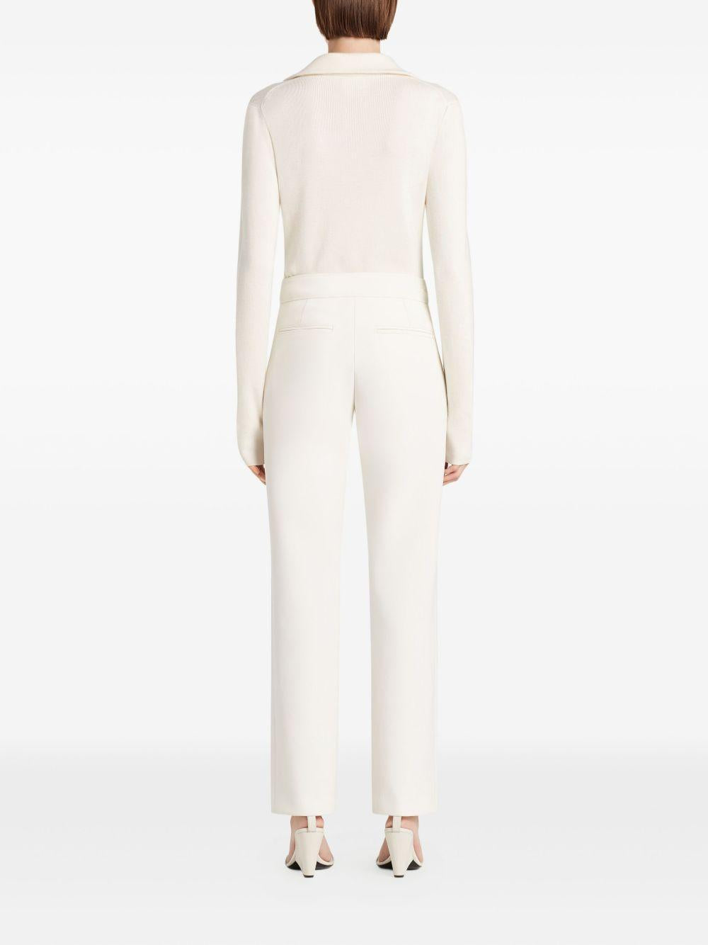 COURREGES Polo bianca con chiusura a zip sul collo