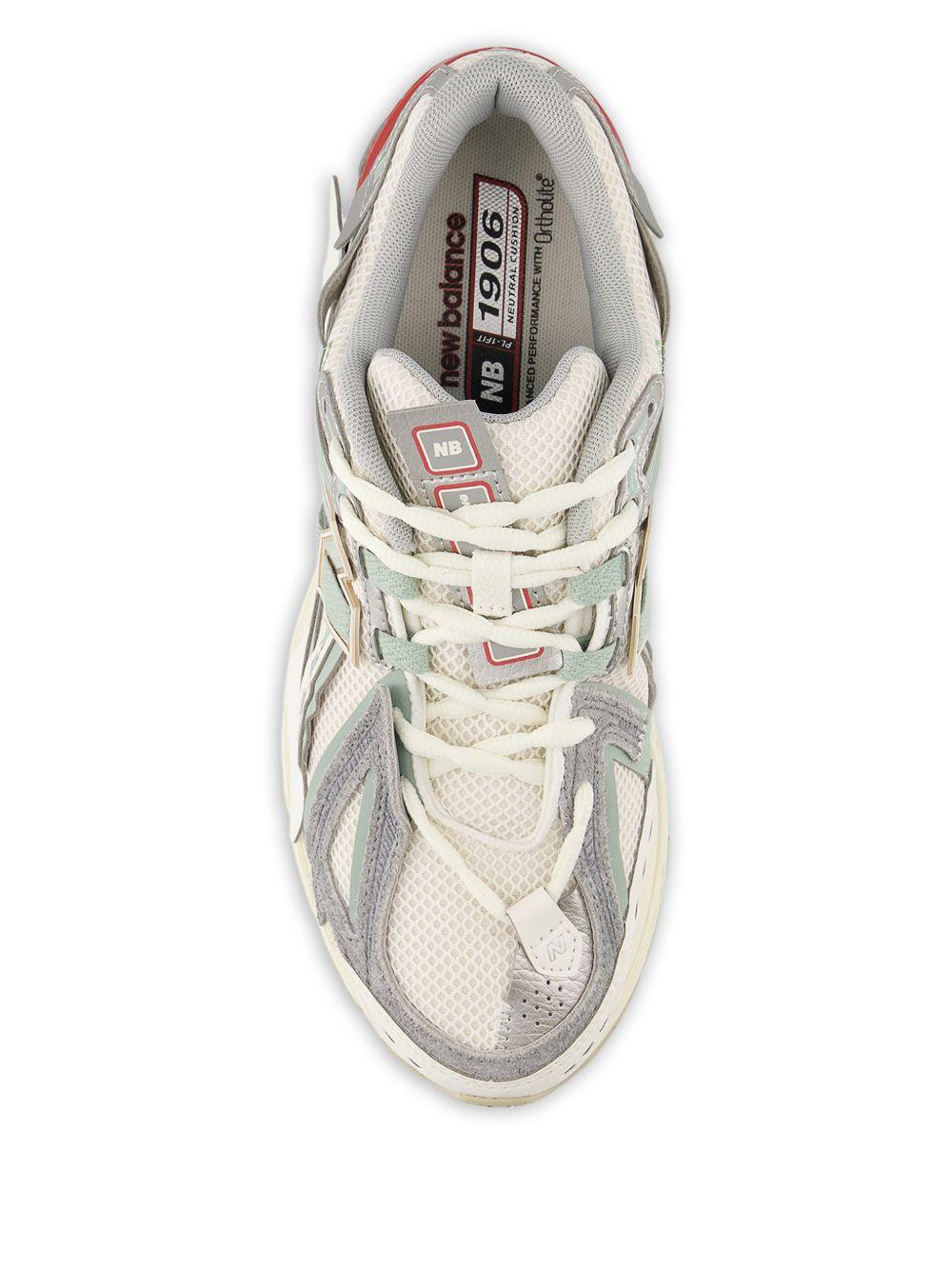 NEW BALANCE Sneakers 1906 bianche grigie e rosse