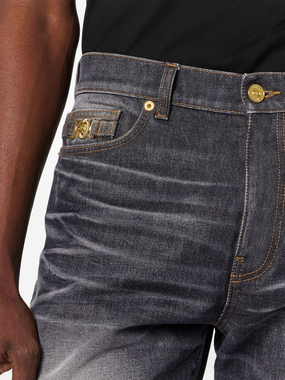 VERSACE Jeans neri slavati con dettaglio medusa