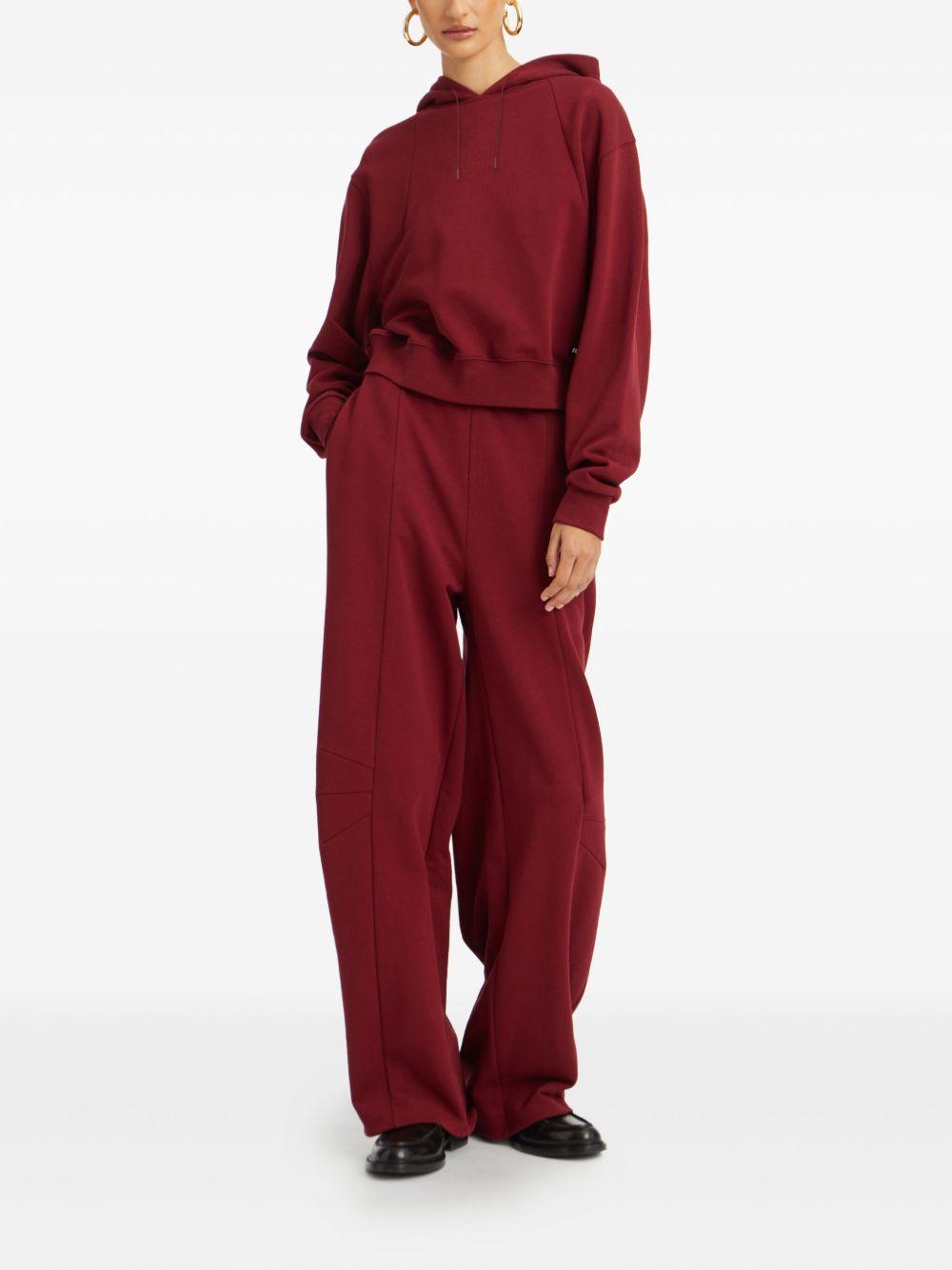 ROTATE Pantaloni sportivi tuta burgundy