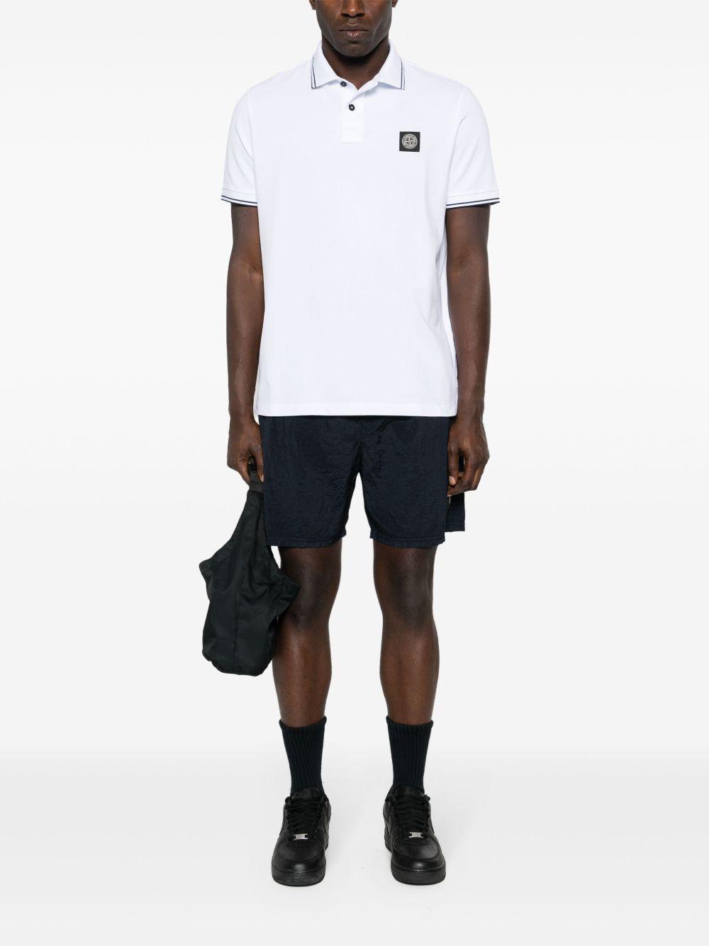 STONE ISLAND Polo in cotone bianco con logo
