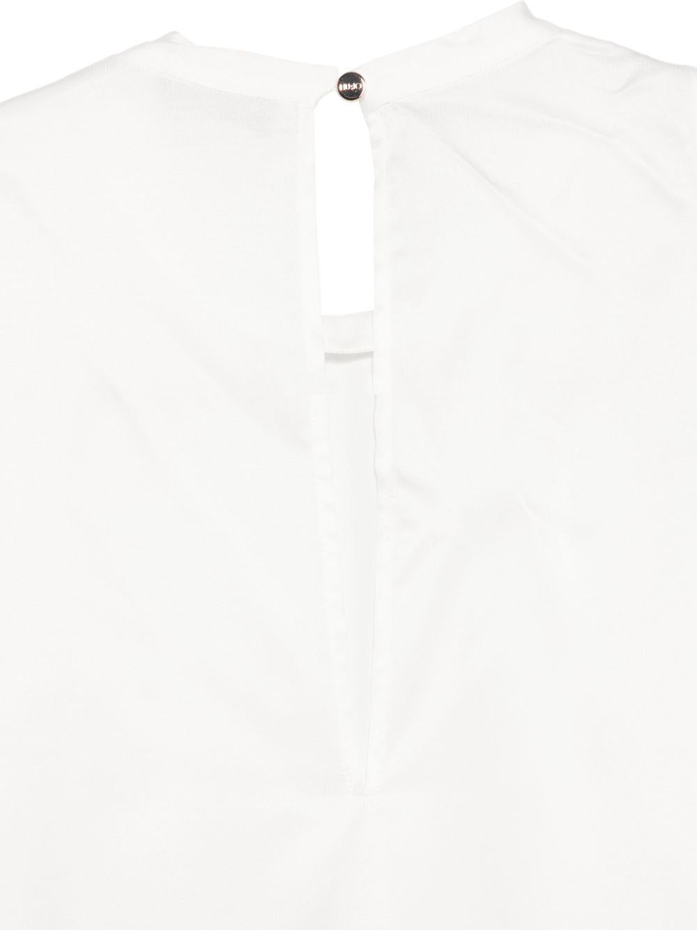 LIUJO Top bianco asimmetrico senza maniche