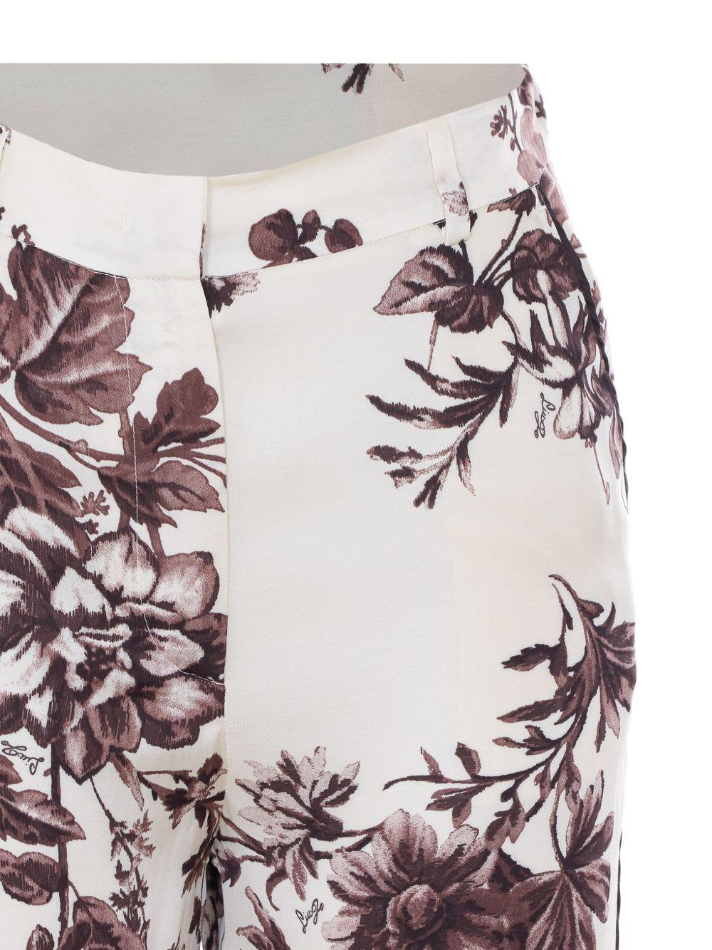 LIUJO Pantaloni bianchi con stampa floreale marrone
