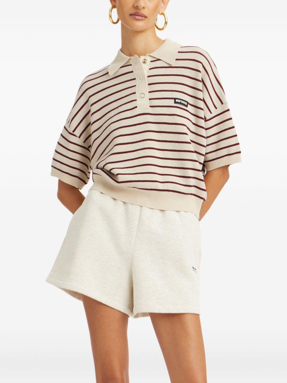 ROTATE Polo a righe con patch logo