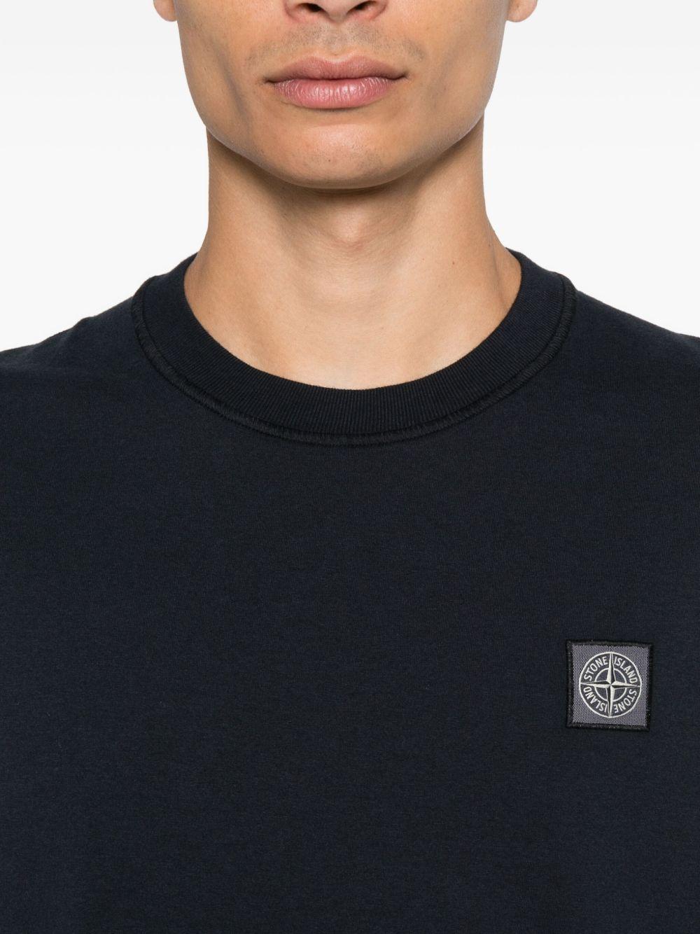STONE ISLAND T-shirt nera in cotone biologico con applicazione logo Compas