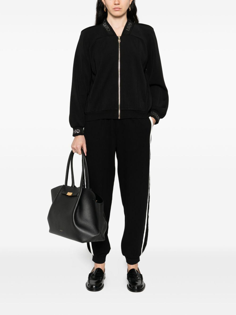 LIUJO Pantaloni neri sportivi bande laterali bianche