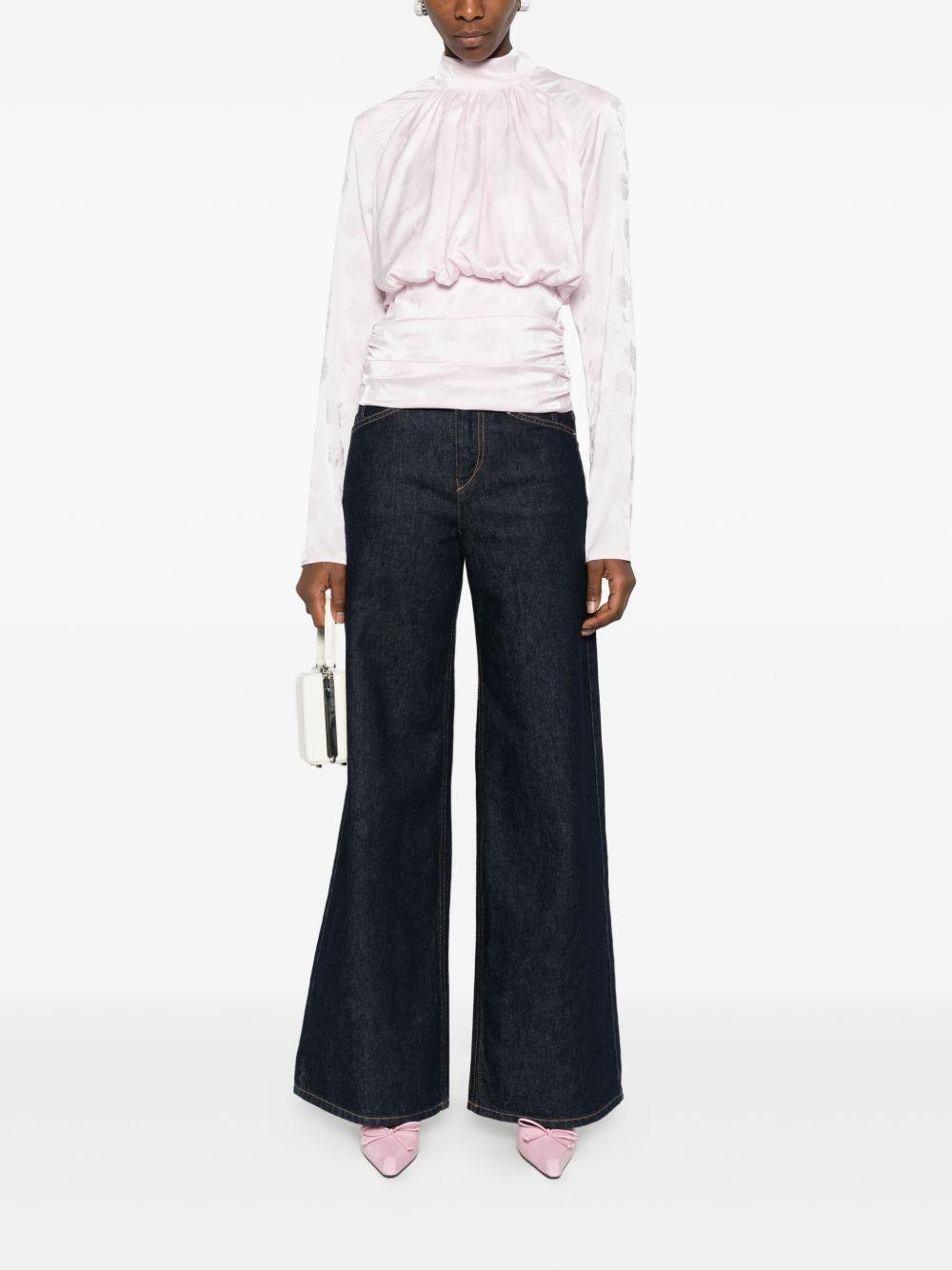 ROTATE Top rosa cipria con grafica floreale all-over