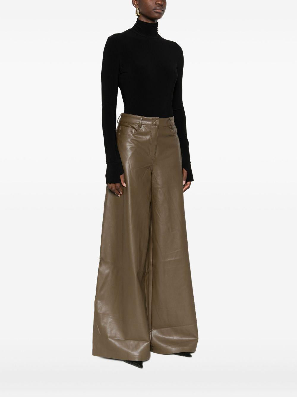 NORMA KAMALI Body nero a collo alto