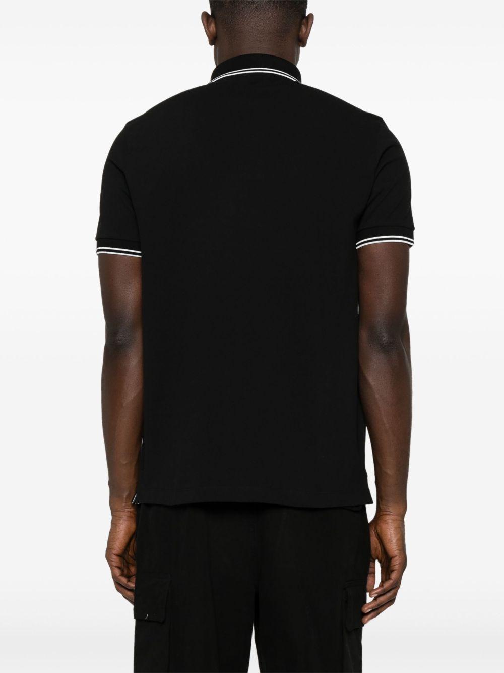 STONE ISLAND Polo in cotone nero con logo