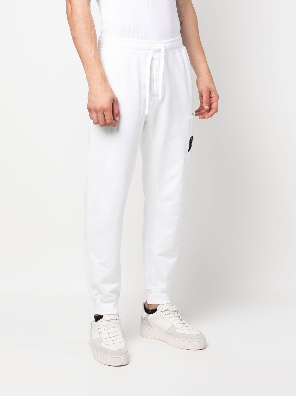 STONE ISLAND Pantaloni di tuta in cotone bianco con logo