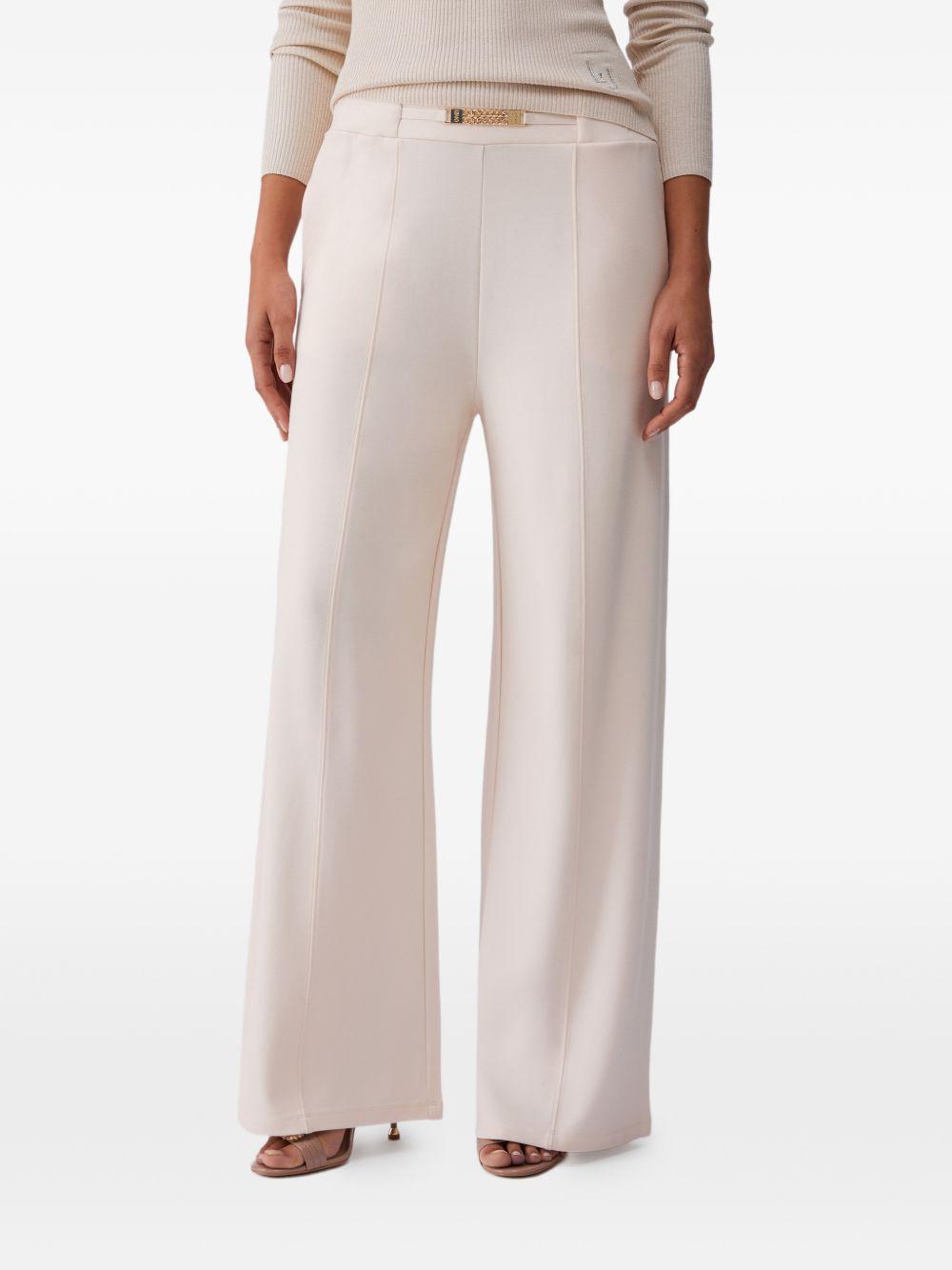 LIUJO Pantaloni cremai in jersey con dettaglio catena