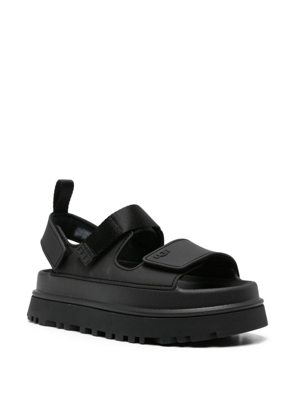 UGG Sandali neri con strappi e logo