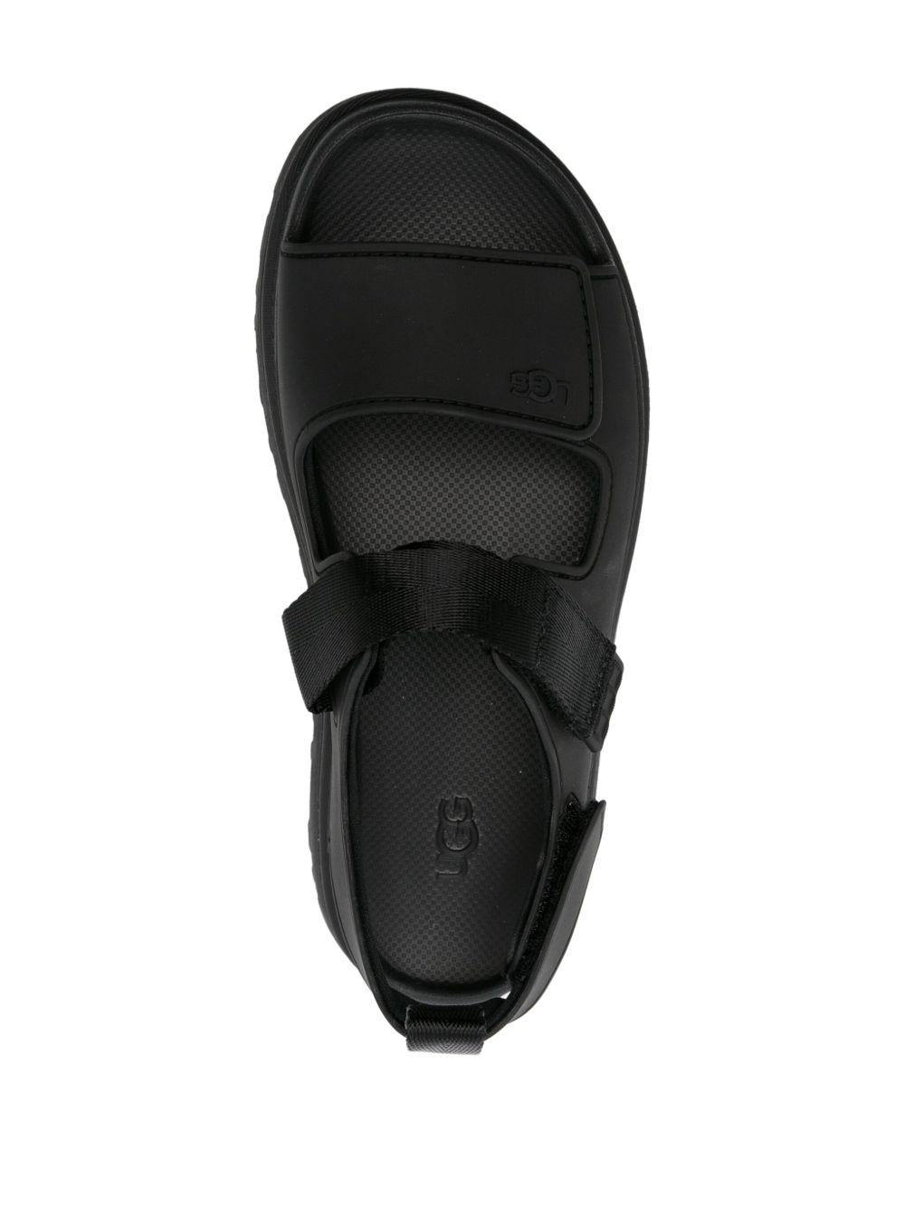 UGG Sandali neri con strappi e logo
