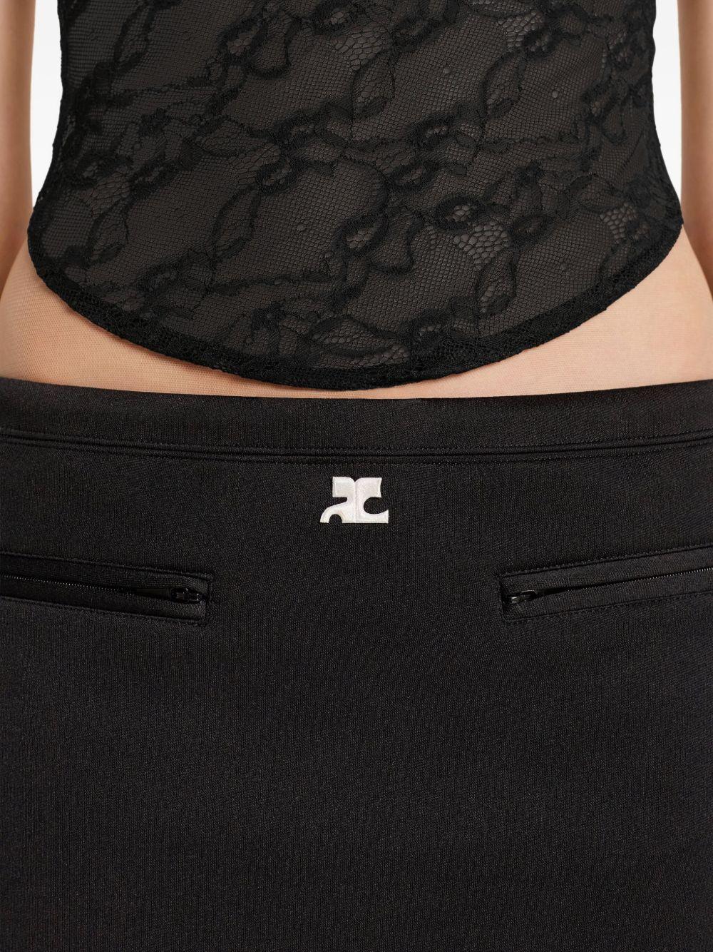 COURREGES Gonna nera con mini tasche frontali