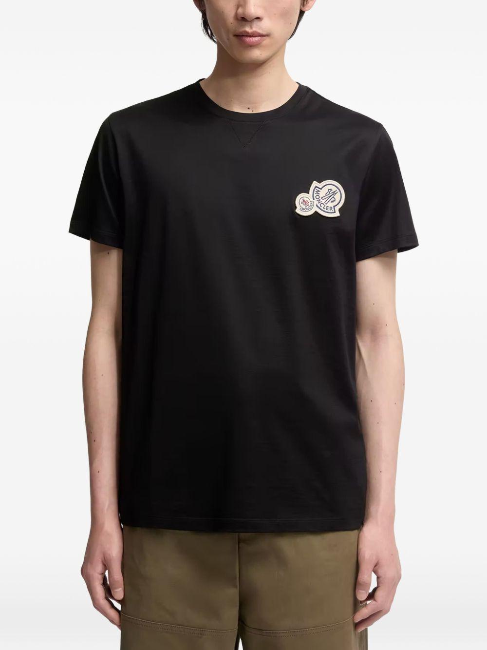 MONCLER T-shirt nera in cotone con logo ricamato