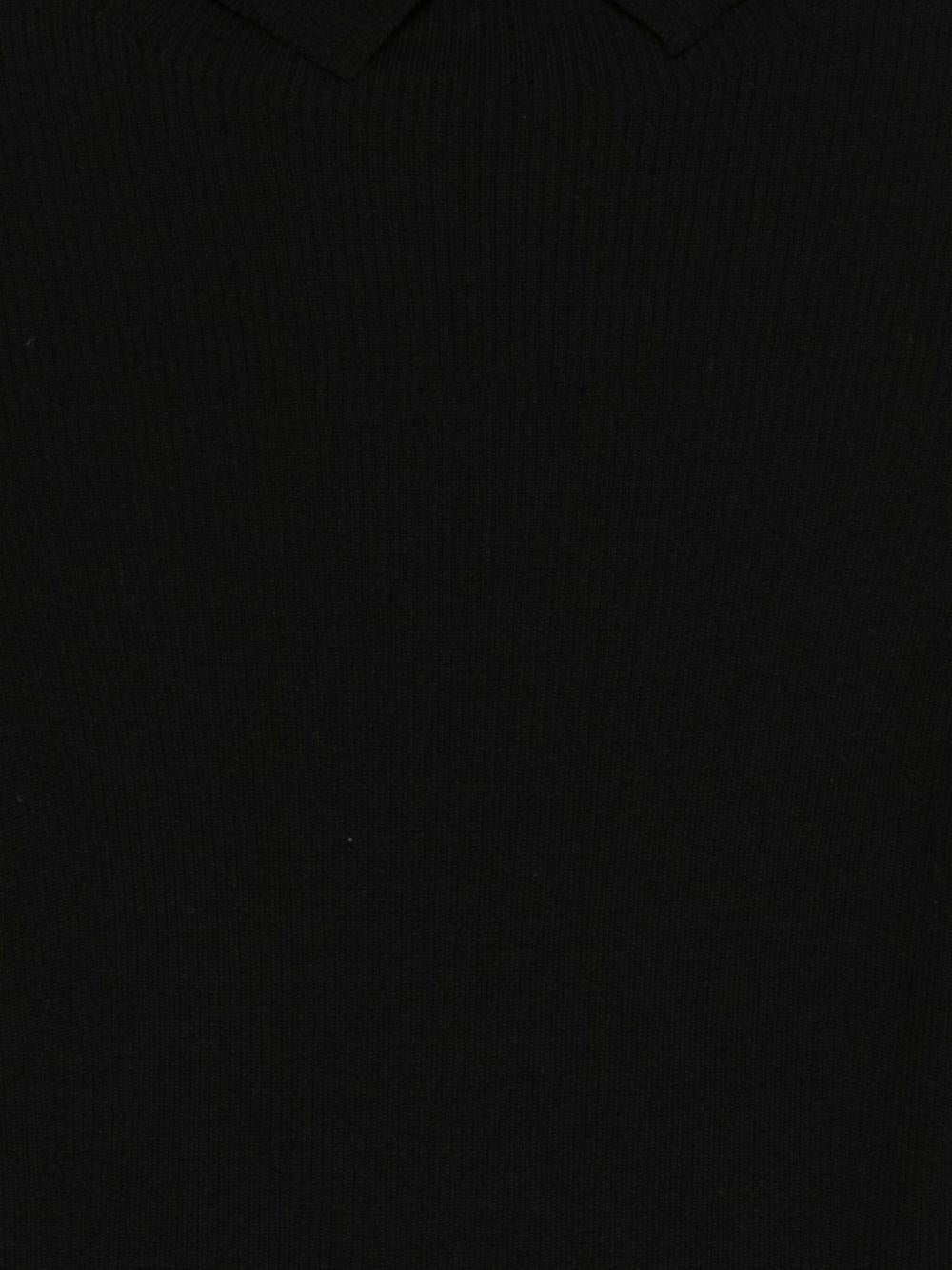 D EXTERIOR Maglia nera con spalle scoperte