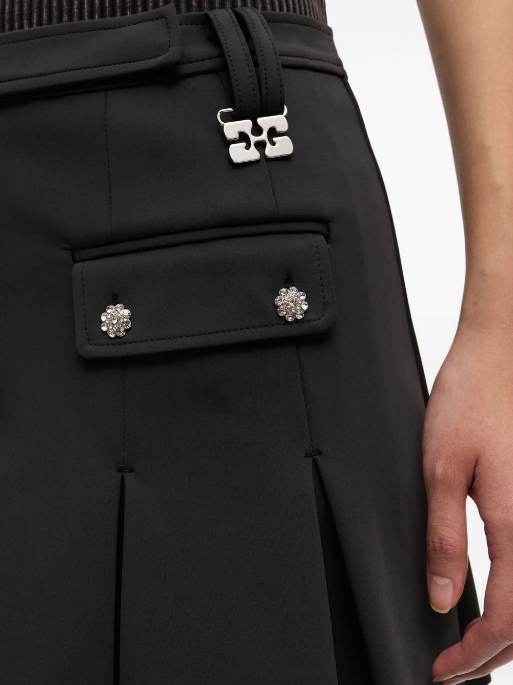 GANNI Minigonna nera plissettata con dettagli argentati