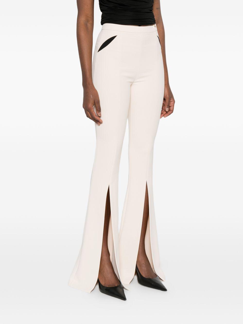 ELISABETTA FRANCHI Pantaloni bianchi con dettagli neri e spacchi sulla gamba