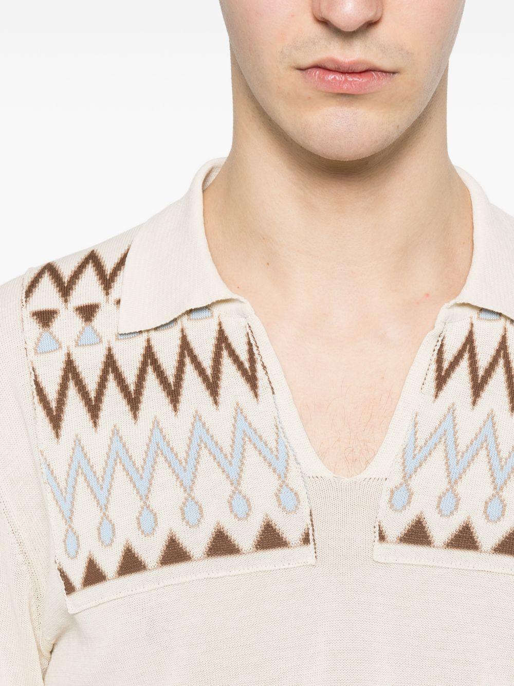 RAKKI Polo in cotone bianco con fantasia a maniche lunghe