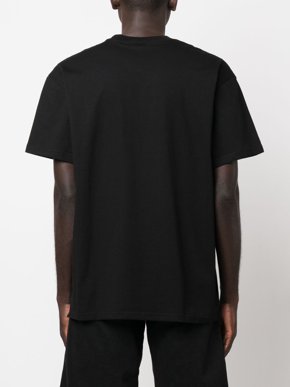 CARHARTT WIP T-shirt in cotone nero con tasca e logo cuore 