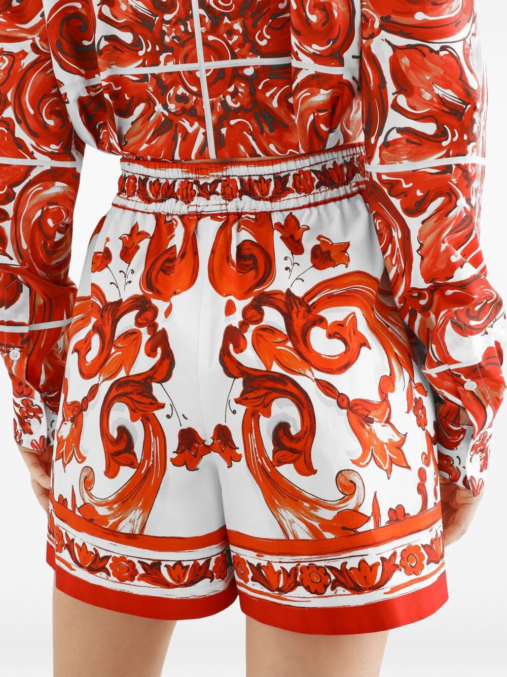 DOLCE e GABBANA Shorts in cotone arancione con stampa grafica 