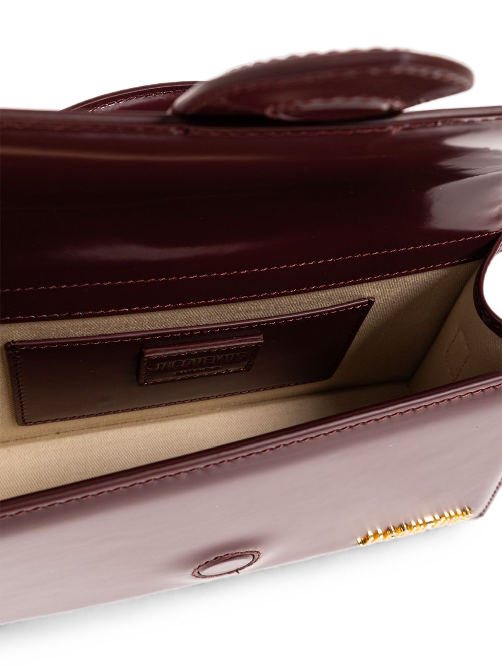JACQUEMUS Borsa Le Grand Bambino bordeaux in pelle lucida con logo dorato 