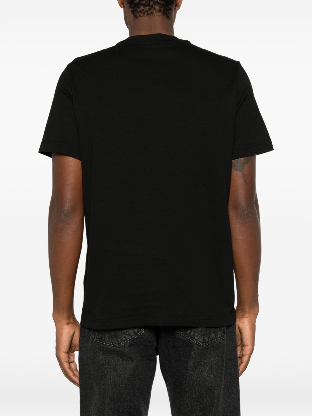MONCLER T-shirt nera a maniche corte con logo sul petto 