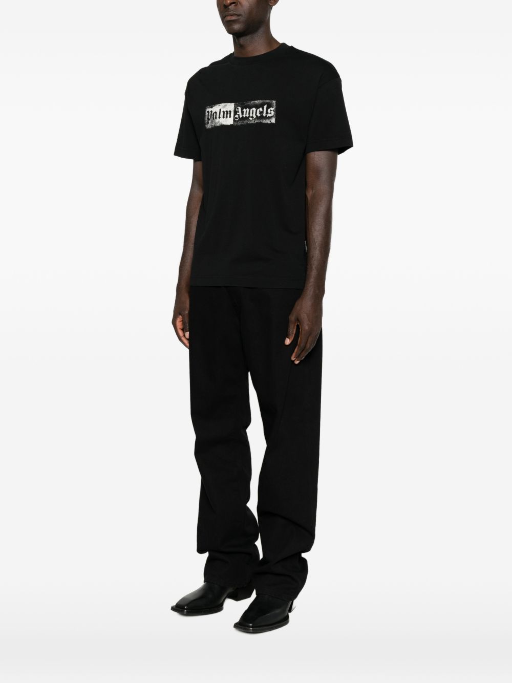 PALM ANGELS T-shirt girocollo nera a maniche corte con stampa tipografica bianca 