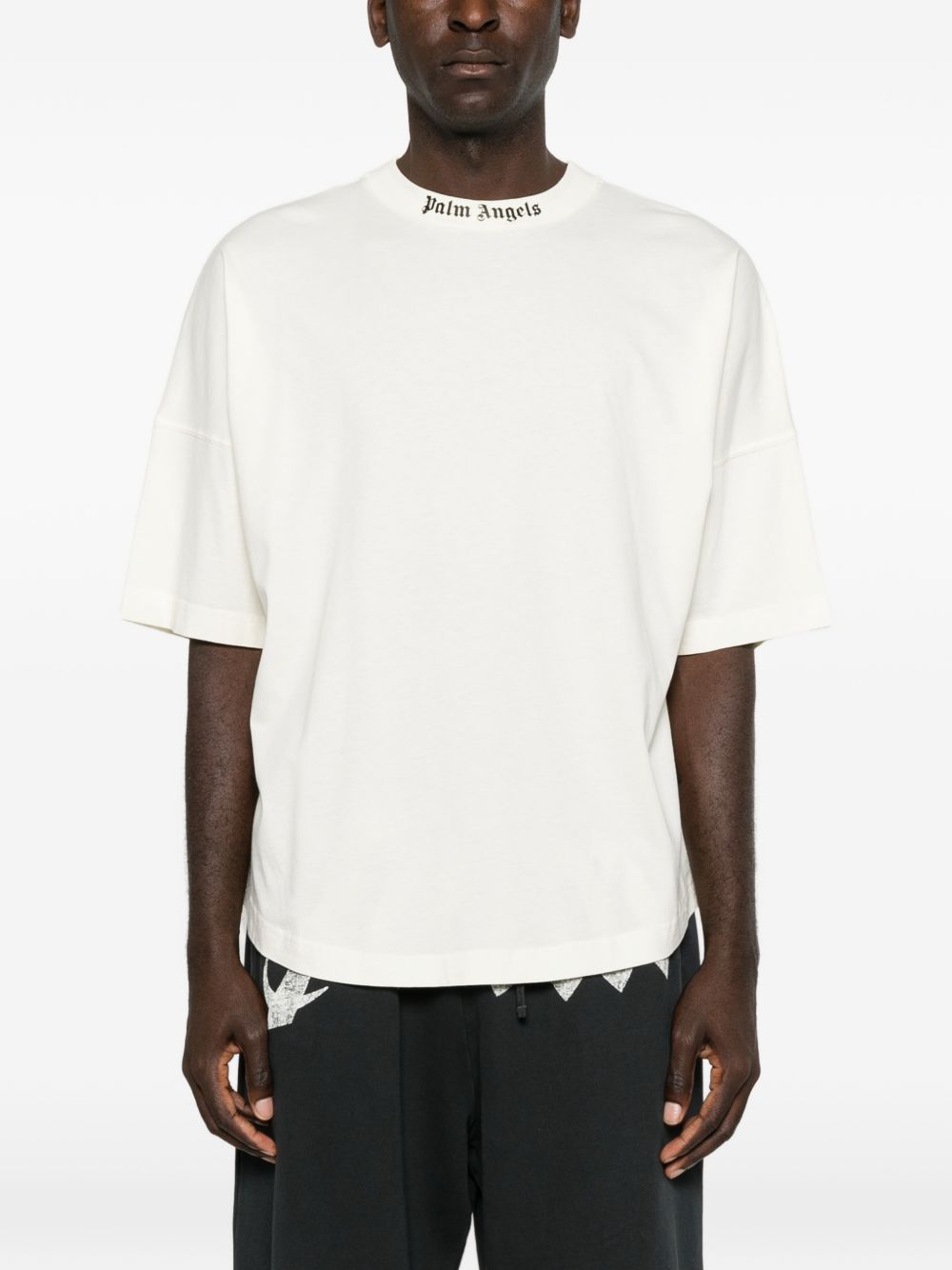 PALM ANGELS T-shirt minimal bianca a maniche 3/4 con logo sul girocollo 