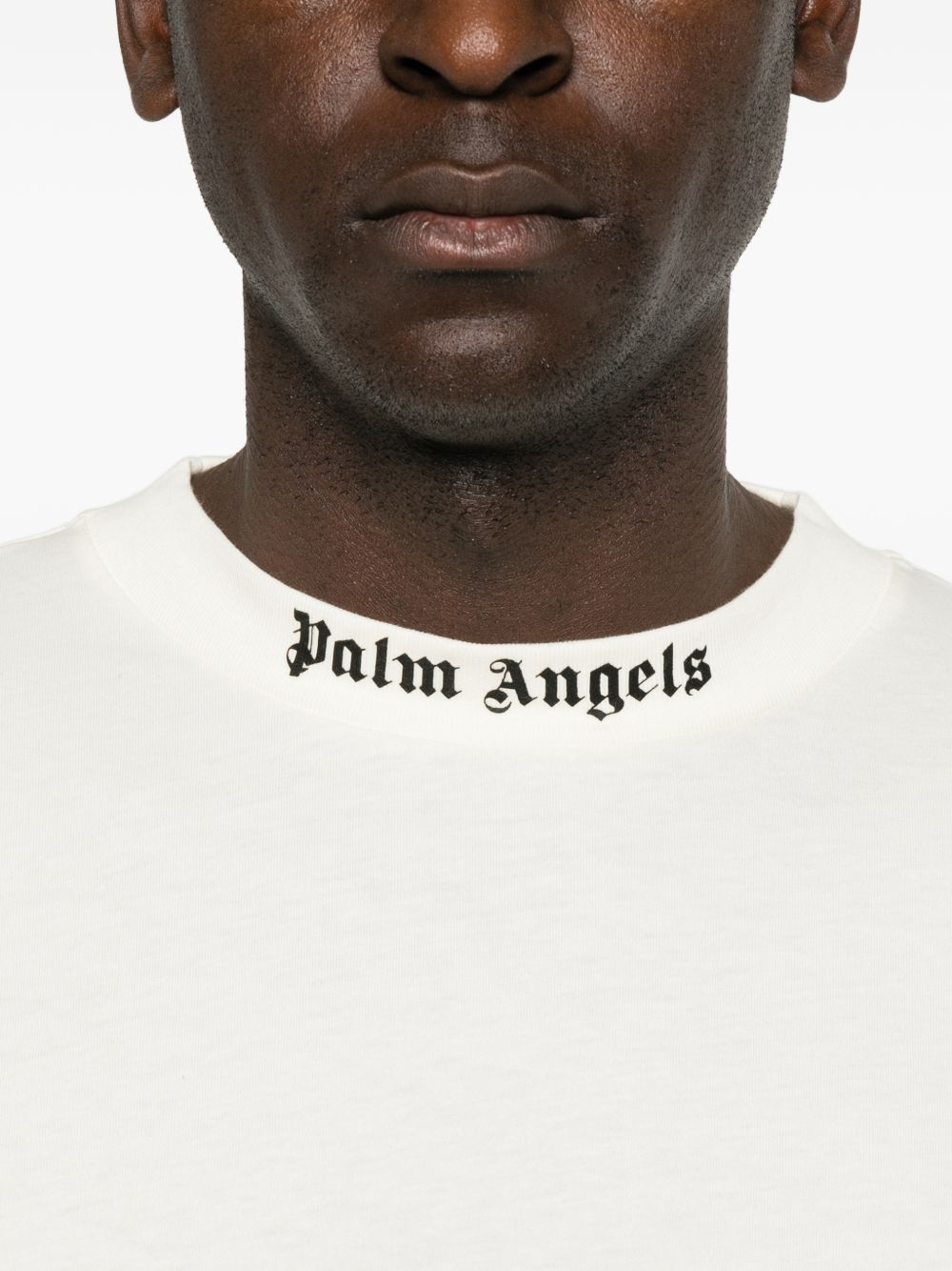 PALM ANGELS T-shirt minimal bianca a maniche 3/4 con logo sul girocollo 