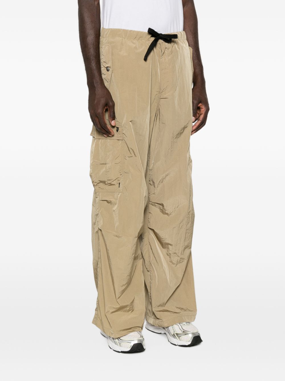 PALM ANGELS Pantalone casual beige in tessuto tecnico lucido 