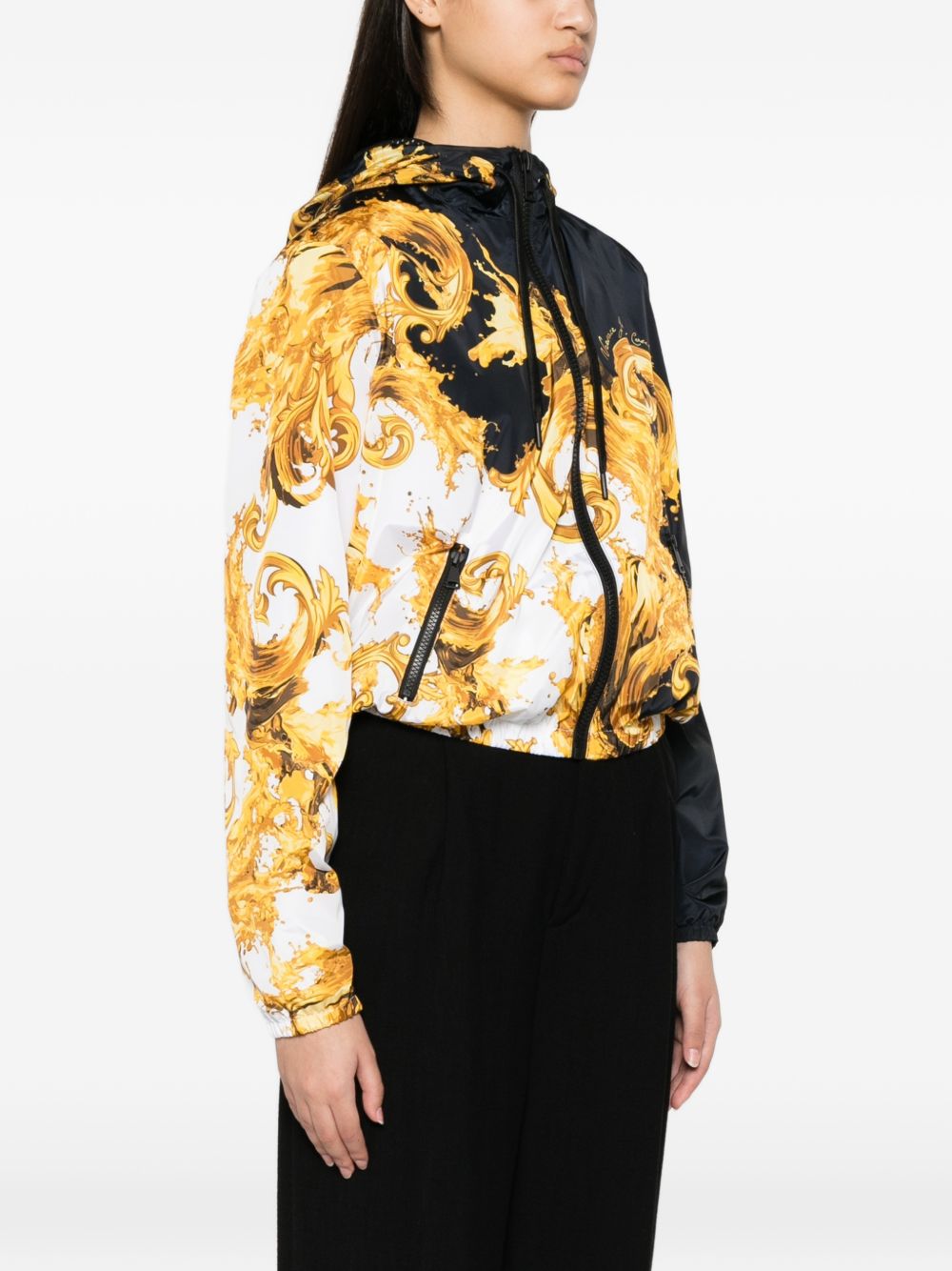 VERSACE JEANS COUTURE Giacca nera e bianca con stampa barocca e cappuccio 