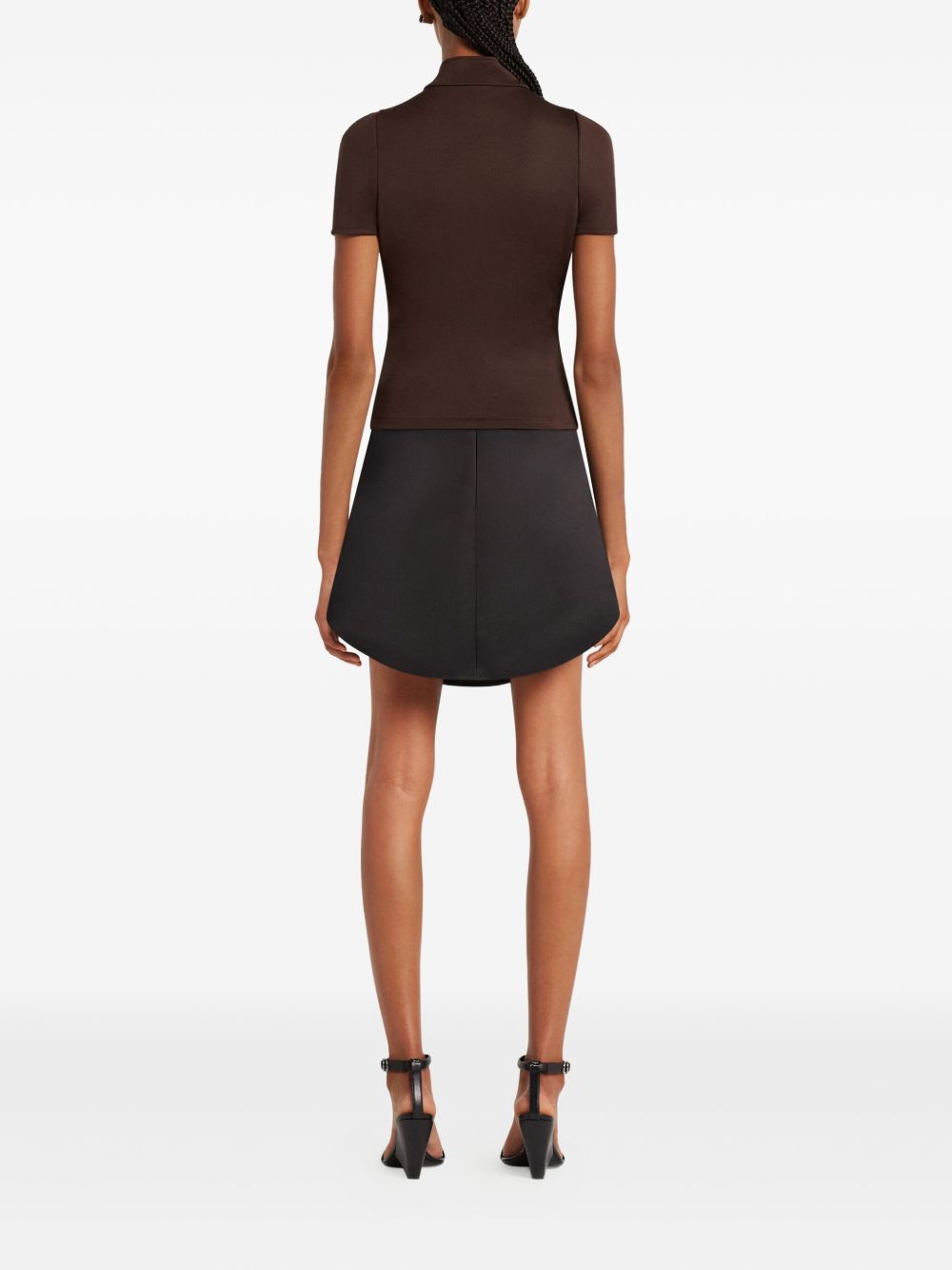 COURREGES Top nero con zip centrale e logo 