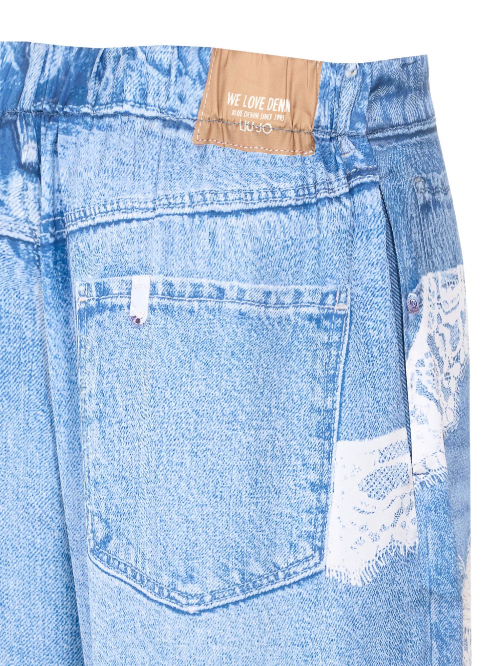 LIUJO Jeans con dettagli strappati e pizzo bianco 