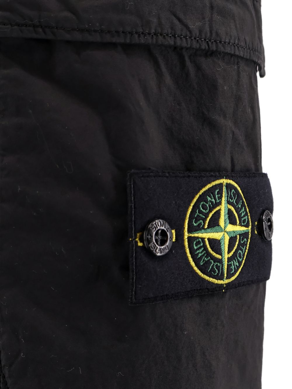 STONE ISLAND Pantaloni neri con patch logo e tasche 